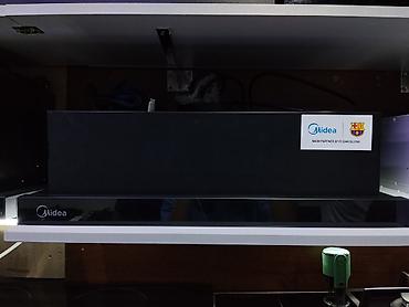 Встраиваемая выдвижная кухонная вытяжка Midea. Основные особенности