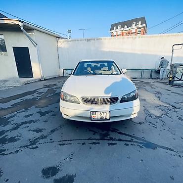diska 13: Nissan Sunny: 2002 г., Автомат, Бензин, Седан — 9