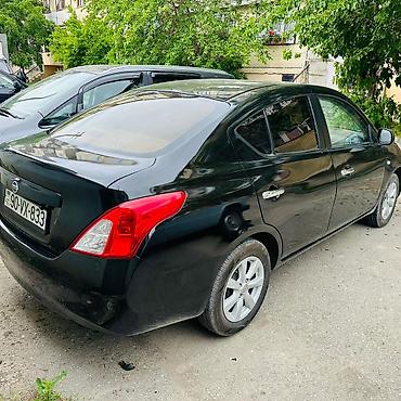 2012 07: Nissan Sunny: 1.5 l | 2012 il Sedan — 4