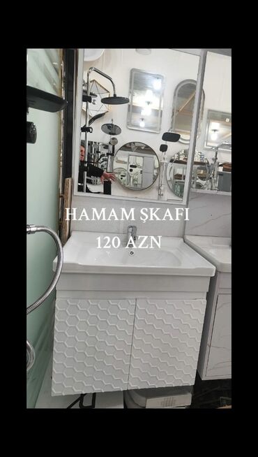 hamam ucun dolab: Ağ rəngdə, divara quraşdırılan hamam dolabı. Dolabın ön hissəsində bal