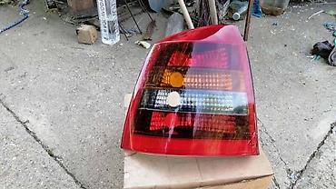 oval: LEVA STOP LAMPA(ZATAMNJENA) ZA OPEL ASTRA G OD 1998. DO 2004. GOD. | — 1