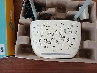 TP-Link Wi‑Fi router - Model: TP-Link (qutuda “300 Mbps Wi‑Fi” və “N”