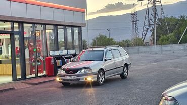 машины покупка: Универсал Toyota Avensis серебристого цвета с рейлингами на крыше