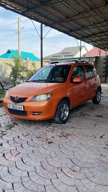 автомобили в расрочку: Mazda Demio: 2003 г., 1.3 л, Автомат, Бензин, Универсал