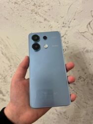 Mətbəx texnikası: Redmi smartfon – mavi rəngli, düz kənarlı korpus dizaynı ilə. Önəmli