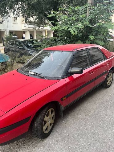 Mazda 323: 1.6 l | 1992 year Hatchback