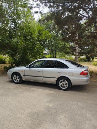 насос для автомобиля: Mazda 626: 1999 г., 2 л, Автоматтык, Газ, Хетчбек