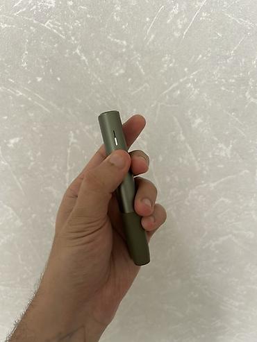 iqos stick: Məhsul: IQOS Iluma One (yaşıl rəng) Xüsusiyyətlər: - Tütün çubuqları — 2