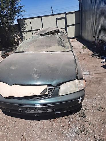 уплотнител: Mazda 626: 1999 г., Автомат, Седан — 1