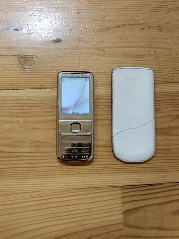 Nokia: Nokia 6700 Slide, 2 GB, rəng - Qızılı, Düyməli