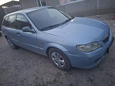 мтз 92 п: Mazda 323: 2002 г., 1.6 л, Механика, Бензин, Универсал — 1