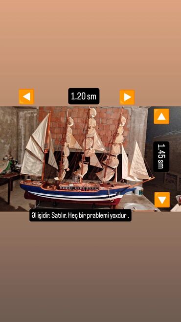 model iş: Taxtadan hazırlanmış bu gəmi modeli mavi, ağ və qırmızı rənglərdə