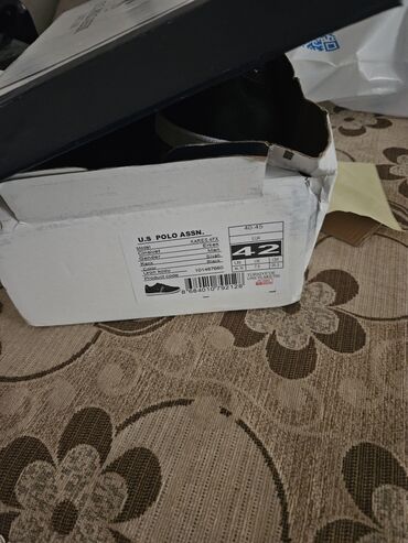 Qara rəngli, dəbli US Polo Assn. idman ayaqqabıları. Yüngül və rahat
