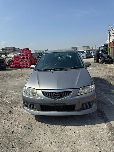 mazda 2000: Крыло Переднее правое Mazda, 2004 г., Б/у, Оригинал — 1