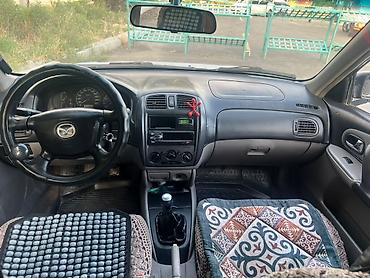 byd bot 384: Mazda 323: 2001 г., 1.6 л, Механика, Бензин, Универсал — 6