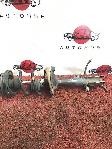 Передний амортизатор Nissan 2000 г., Б/у, Оригинал