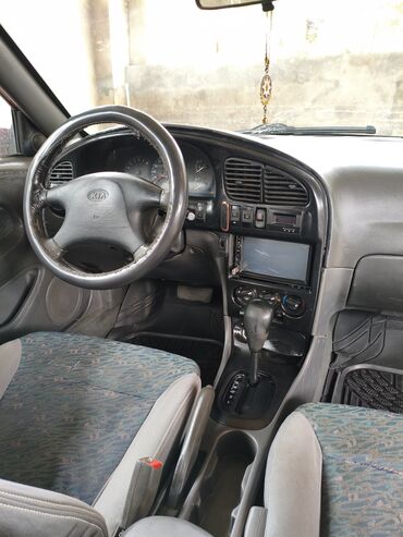 Kia: Kia Sephia: 1.6 l | 1998 il Sedan — 13