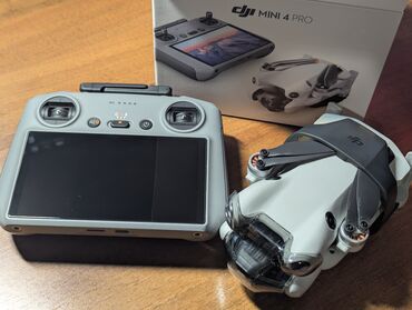 объектив фото: DJI Mini 4 Pro RC 2 (пульт с экраном) Возможности: - Камера 1/1.3" с