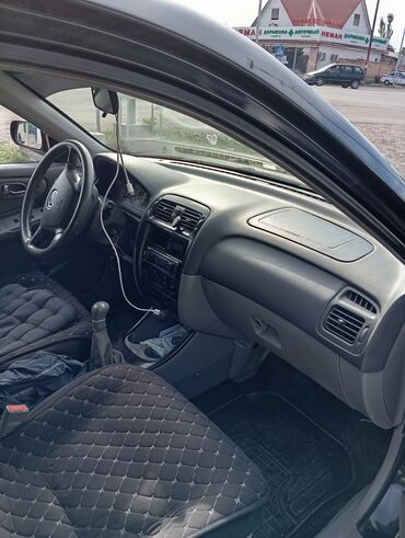 меняю на недвижимость: Mazda Capella: 2001 г., 1.8 л, Механика, Бензин, Седан