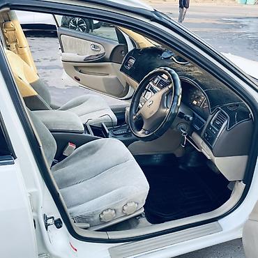 diska 13: Nissan Sunny: 2002 г., Автомат, Бензин, Седан — 3