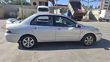 duman fara: Mitsubishi Lancer: 1.6 l | 2006 il 466000 km Sedan — 5