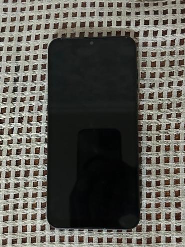 iphone oxşar telefonlar: Mavi rəngdə smartfon - Arxa tərəfdə ayrı-ayrı yerləşdirilmiş 3 — 2