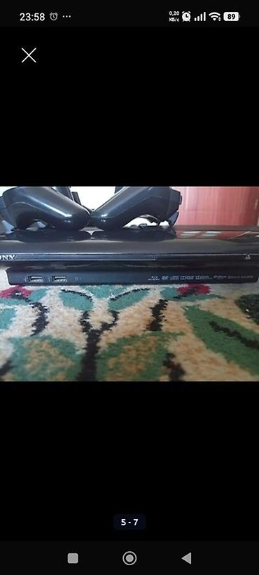 рии: Игровая приставка Sony PlayStation 3 Super Slim с двумя беспроводными — 1