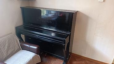 Пианино: Upright pianino – klassik qara korpus, üst paneldə dekorativ naxışlı — 2
