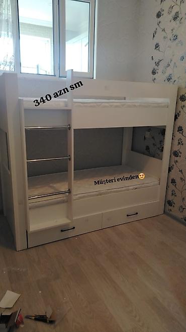 Uşaq mebeli: Ağ rəngdə iki mərtəbəli uşaq çarpayısı. Xüsusiyyətlər: - Kompakt — 1