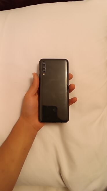 Аудиотехника: Samsung Galaxy A50, 64 ГБ, цвет - Черный, Отпечаток пальца