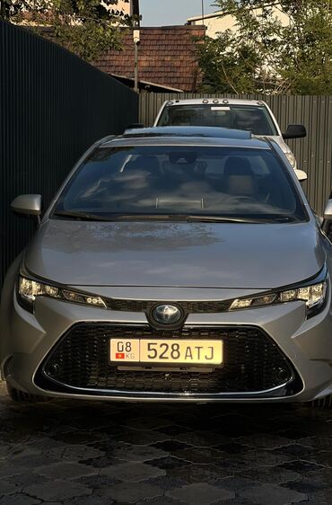 электронный машине: Toyota Corolla: 2019 г., 1.8 л, Автомат, Гибрид, Седан