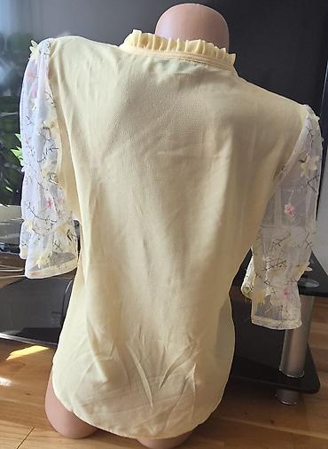 Bluze: Sedam bluzica sa neznatnim tragovima korišćenja. Zelena - M veličina — 4