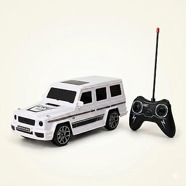 машина пултом: Радиоуправляемая модель автомобиля SUV (стилизованный внедорожник) с — 1