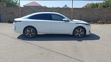 авто базар: Elektrik sedan – ağ rəng, aerodinamik fastback kuzov, zərif LED — 3