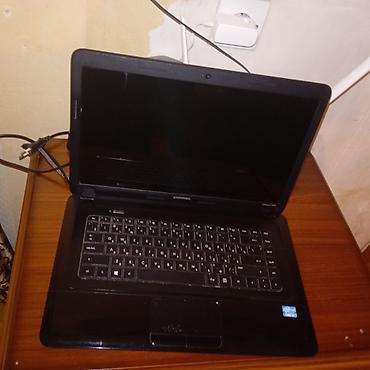 compaq laptop: HP Compaq noutbuk - Model: Compaq (üst qapaqda Compaq loqosu, daxildə — 2