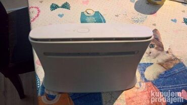 Modemi, ruteri i mrežni uređaji: Various used modems and routers from brands like Sagemcom, ZTE — 5