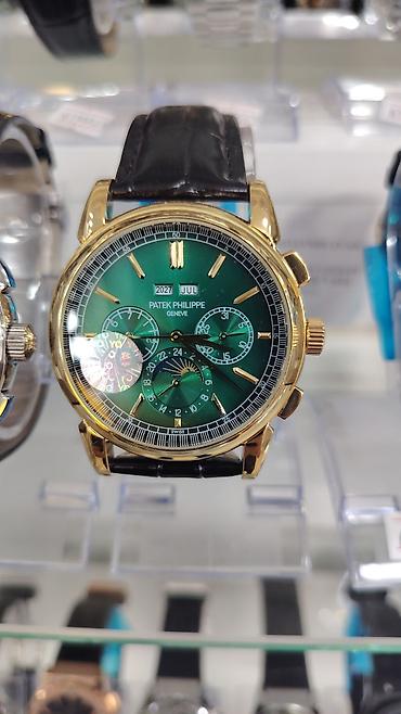 saat omega: Patek Philippe Geneve kişi qol saatı – klassik üslubda, çoxfunksiyalı — 9