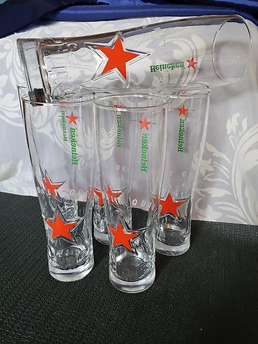 Čaše: Case nove za pivo Heineken. Case nove,sve na njima odsjaj od svetla — 7