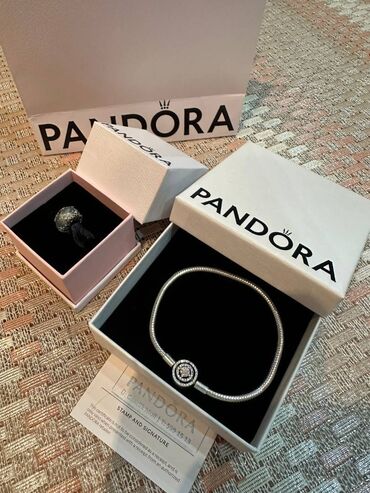 charm: Pandora ideal veziyyetdedir. 1 ay ishlenmeyib hec. Pandoranin ozunden