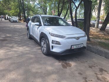 кара электро: Белый электрический кроссовер Hyundai Kona Electric. Алмашуу жолдору
