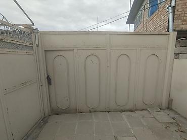 Həyətyanı sahəsi olan yaşayış evi - Darvazalı, hasarlı torpaq sahəsi;