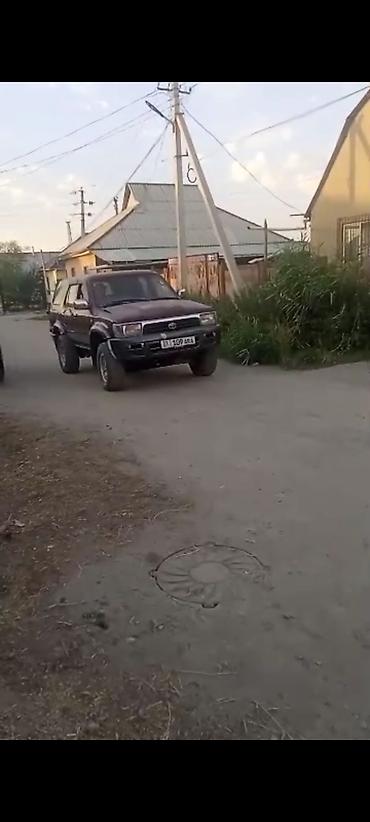4х4 афто: Полноприводный внедорожник бордового цвета с запасным колесом — 2