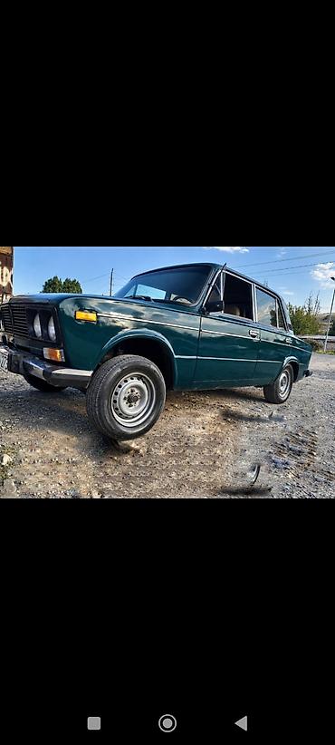 si yagi qiyməti: VAZ 2106, 2001-ci il buraxılışı. Şəkillərdə tünd yaşıl rəngli sedan — 1