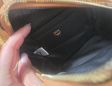 Modni rančevi: MCM mini stark ranac konjak braon boje sa monogram printom. Nov je — 7