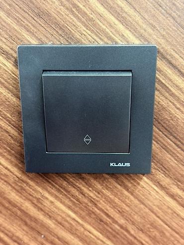 Выключатели: Настенные выключатели KLAUS, графитовый матовый цвет. Описание: - — 5