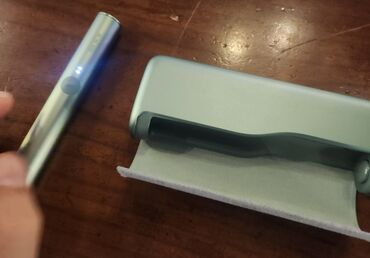 Bu, tütün çubuqlarını qızdırmaq üçün nəzərdə tutulmuş bir "IQOS"