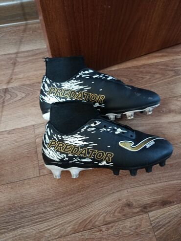 футбольный мяч joma: Черные футбольные бутсы Joma Predator с белыми и золотыми акцентами
