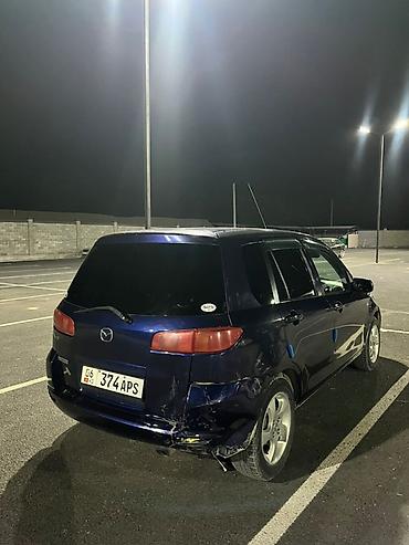 рул: Mazda Demio: 2002 г., 1.3 л, Автомат, Бензин, Хетчбек — 4