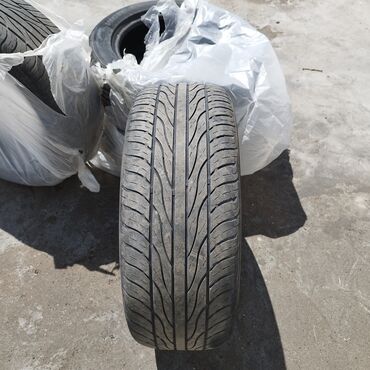 рага на крышу: Шина размером 235/55ZR18 с индексом нагрузки 104W. Рисунок протектора