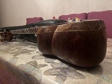 gitara satilir: Tar – milli simli musiqi aləti, sərt futlyarla Xüsusiyyətlər: - — 5